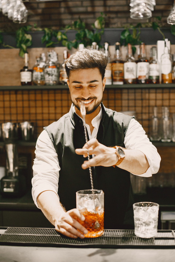Bartender Mixing Alcoholic Drink in a Glass